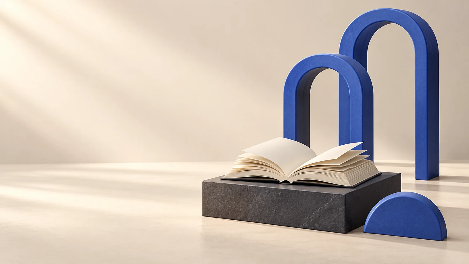 Due archi blu affiancano un libro aperto su un basamento grafite, con un semicerchio decorativo.
